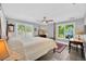 Comfortable bedroom with views of the water, a ceiling fan, and a cozy feel at 2802 Northpointe Ln, Tampa, FL 33611