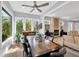 Open concept dining room flows into a living room with fireplace and plentiful natural light at 2802 Northpointe Ln, Tampa, FL 33611