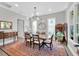 Elegant dining room with contemporary lighting, large windows, and seating for six at 2802 Northpointe Ln, Tampa, FL 33611