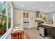 Bright kitchen features a breakfast nook and ample storage space in the cabinets at 2802 Northpointe Ln, Tampa, FL 33611