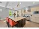 Bright kitchen featuring a large center island, stainless steel appliances, and plenty of cabinet space at 2802 Northpointe Ln, Tampa, FL 33611