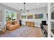 Cozy living room features abstract artwork, a comfortable couch, and stylish lighting at 2802 Northpointe Ln, Tampa, FL 33611