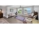 Bright living room featuring large windows with water views and classic, comfortable furnishings at 2802 Northpointe Ln, Tampa, FL 33611