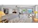 Spacious main bedroom featuring water views and a cozy sitting area at 2802 Northpointe Ln, Tampa, FL 33611