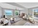 Sitting room area with beautiful waterfront views from multiple large windows at 2802 Northpointe Ln, Tampa, FL 33611