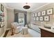 Bedroom with white crib, neutral walls, wood floors and framed wall decor at 2911 W Estrella St, Tampa, FL 33629