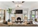 Bright living room with white brick fireplace, large TV, and stylish decor at 2911 W Estrella St, Tampa, FL 33629
