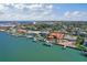 Waterfront home featuring dockage and a beautiful outdoor swimming pool and patio area at 297 1St W St, Tierra Verde, FL 33715