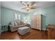 Relaxing bedroom with hardwood floors, a ceiling fan, large window and plenty of natural light at 297 1St W St, Tierra Verde, FL 33715