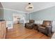 Cozy living room showcases a wet bar, hardwood floors, wainscoting, and recessed lighting at 297 1St W St, Tierra Verde, FL 33715