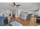 Spacious living room with an open floor plan, kitchen, and staircase at 297 1St W St, Tierra Verde, FL 33715