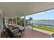 Enjoy outdoor living on this covered deck with waterfront views and ample seating for relaxation and entertaining at 297 1St W St, Tierra Verde, FL 33715