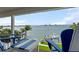 Beautiful deck with seating overlooking lush landscaping and the bay at 297 1St W St, Tierra Verde, FL 33715