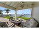 Covered patio with outdoor seating area overlooking the waterfront at 297 1St W St, Tierra Verde, FL 33715