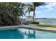 Beautiful pool with a waterfront view offers a relaxing outdoor space for entertaining at 297 1St W St, Tierra Verde, FL 33715