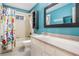 Bathroom featuring shower-tub combo with floral curtain and granite vanity at 3013 Crest Dr, Clearwater, FL 33759