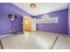 Spacious bedroom with high ceilings, tile floor, and a decorative chandelier at 3013 Crest Dr, Clearwater, FL 33759