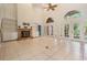 Spacious living room with a fireplace, built-in shelving, and access to the backyard at 3013 Crest Dr, Clearwater, FL 33759