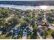 Scenic aerial view of a waterfront community with lush greenery and stunning lake views at 3047 Lake Padgett Dr, Land O Lakes, FL 34639