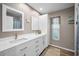 Bright bathroom with double sink vanity, neutral paint, and decorative accents adds warmth at 3047 Lake Padgett Dr, Land O Lakes, FL 34639