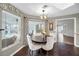 Bright dining area leads to more living space and features hardwood floors at 3047 Lake Padgett Dr, Land O Lakes, FL 34639