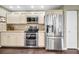 Charming kitchen with stainless steel appliances and off-white cabinets at 3047 Lake Padgett Dr, Land O Lakes, FL 34639