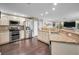 Gourmet kitchen with stainless appliances, granite counters and dark hardwood floors at 3047 Lake Padgett Dr, Land O Lakes, FL 34639