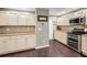 Classic kitchen features granite countertops, stainless steel appliances and ample cabinet space at 3047 Lake Padgett Dr, Land O Lakes, FL 34639