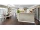 Open kitchen with stainless appliances, granite countertops and hardwood floors at 3047 Lake Padgett Dr, Land O Lakes, FL 34639