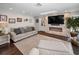 Open living area with a stone fireplace, built-in shelving, and lots of light at 3047 Lake Padgett Dr, Land O Lakes, FL 34639