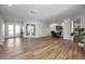 Spacious living area with modern floors, dual French doors, and a versatile open-concept layout at 3047 Lake Padgett Dr, Land O Lakes, FL 34639