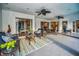Spacious covered patio with wicker furniture and view to interior at 3047 Lake Padgett Dr, Land O Lakes, FL 34639