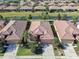 Overhead view of a well-maintained single-Gathering house with tile roof, in a community with canal and mature landscaping at 310 Cedar Falls Dr, Apollo Beach, FL 33572