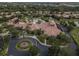 Aerial view of the community clubhouse, pool, and lush landscaping, offering a serene retreat at 310 Cedar Falls Dr, Apollo Beach, FL 33572
