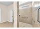 Accessible bathroom features a tiled walk-in shower with grab bars and neutral finishes at 310 Cedar Falls Dr, Apollo Beach, FL 33572
