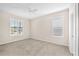 Bright bedroom with large windows and neutral carpet at 310 Cedar Falls Dr, Apollo Beach, FL 33572