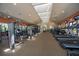 Well-equipped fitness center with modern machines, ample space, and natural light, promoting a healthy lifestyle at 310 Cedar Falls Dr, Apollo Beach, FL 33572