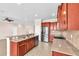 Modern kitchen features stainless steel appliances, granite countertops, and stylish cabinetry at 310 Cedar Falls Dr, Apollo Beach, FL 33572