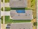 Aerial view of a home with solar panels on the roof and well-maintained landscaping at 32714 Brooks Hawk Ln, Wesley Chapel, FL 33543
