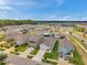 New suburban community featuring well-manicured lawns, spacious homes, and a picturesque lake at 32714 Brooks Hawk Ln, Wesley Chapel, FL 33543