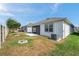 Spacious backyard with healthy lawn and covered patio area at 32714 Brooks Hawk Ln, Wesley Chapel, FL 33543