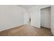 A bright bedroom features neutral carpet, and a closet at 32714 Brooks Hawk Ln, Wesley Chapel, FL 33543