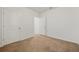 A bright bedroom features neutral carpet and white walls and trim at 32714 Brooks Hawk Ln, Wesley Chapel, FL 33543