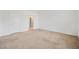 Carpeted bedroom with door to the bathroom and closet at 32714 Brooks Hawk Ln, Wesley Chapel, FL 33543