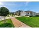 Beautiful home in a peaceful neighborhood, showcasing a well-manicured lawn and charming curb appeal at 32714 Brooks Hawk Ln, Wesley Chapel, FL 33543