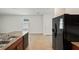 Kitchen features stainless steel appliances, granite countertops and tile flooring at 32714 Brooks Hawk Ln, Wesley Chapel, FL 33543