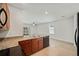 This kitchen is equipped with stainless steel appliances and granite countertops at 32714 Brooks Hawk Ln, Wesley Chapel, FL 33543