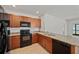 This is a kitchen with modern appliances and granite countertops at 32714 Brooks Hawk Ln, Wesley Chapel, FL 33543