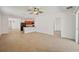 Spacious living room featuring access to the kitchen and adjacent rooms at 32714 Brooks Hawk Ln, Wesley Chapel, FL 33543