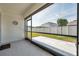 Covered and screened patio area offering outdoor living space with a view of the backyard and fence at 32714 Brooks Hawk Ln, Wesley Chapel, FL 33543